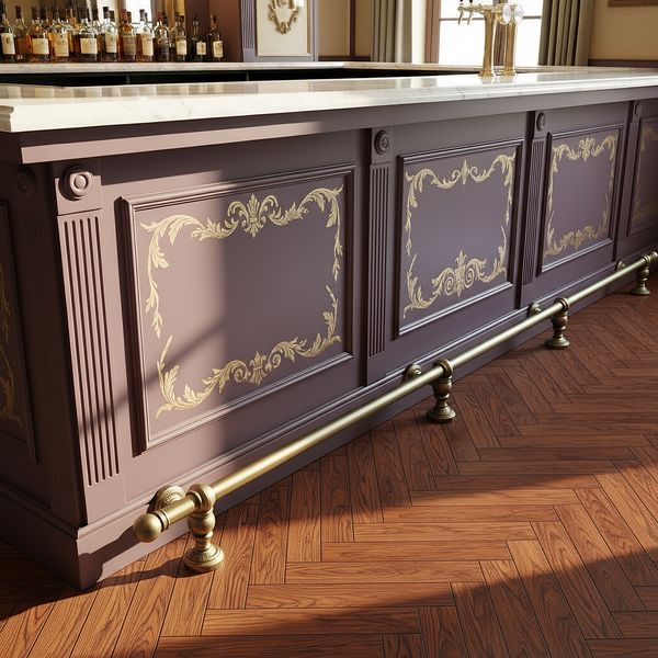 Aged brass finish bar foot rail with ornate rounded brackets and ball end caps beside a decorative panelled bar