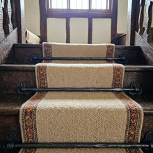 Load image into Gallery viewer, Tudor Trefoil Stair Rods with Hammered Bar, across a carpet runner on wooden stairs
