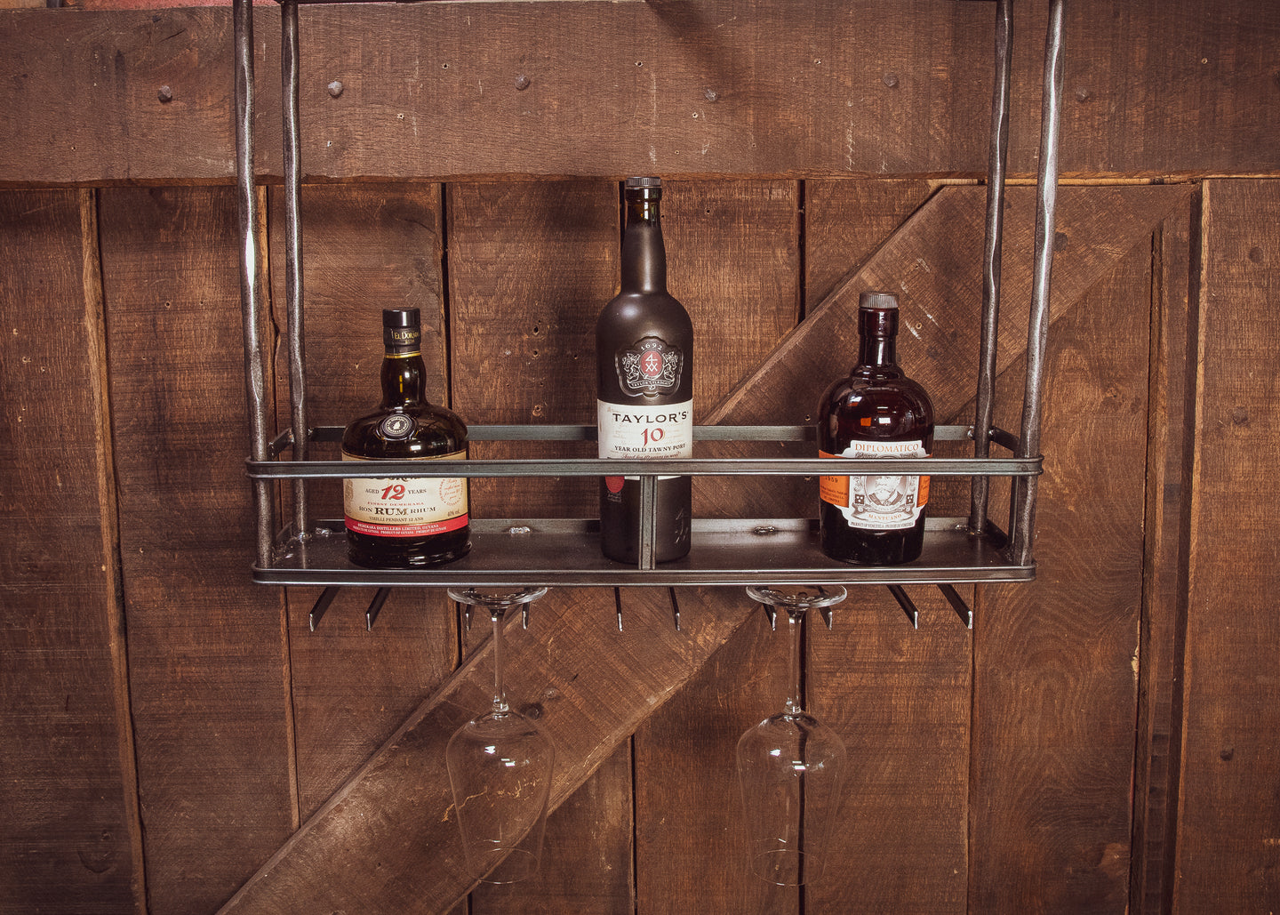 Industrial wine rack ceiling mounted with glass holders